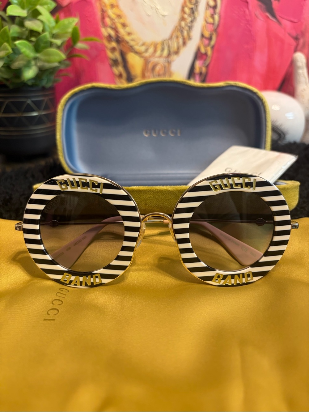 Gucci Black & White Striped Round Women’s Sunglasses with Gold Accents
